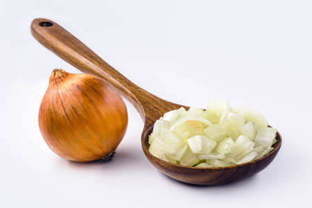 wooden spoon with roasted onion and crushed into pieces to be used as seasoning, white backgroundの写真素材