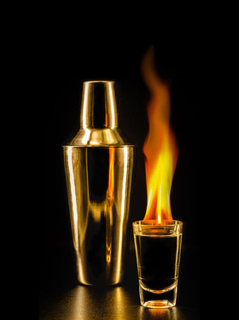 glass with tequila shots on fire, flaming drinkの写真素材