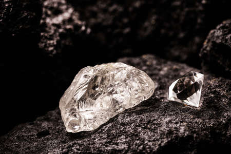 rough diamond and cut diamond in coal mine, mining concept and rare gemstoneの写真素材