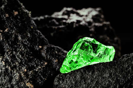 raw emerald gem in rare stone mine, bright green stoneの写真素材