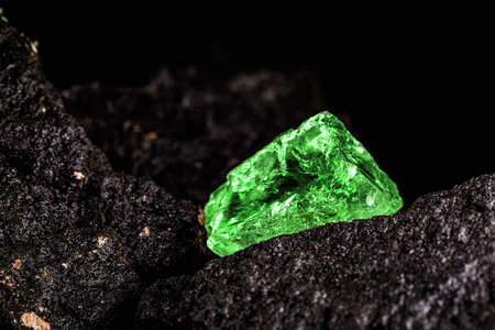 raw emerald gem in rare stone mine, bright green stoneの写真素材