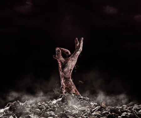 Realistic zombie hand coming out of the pit, theme for halloween, days of the wild or day of the deadの写真素材