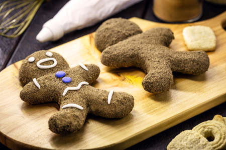 Gingerbread man, Christmas man cookie being covered and decorated by glace, twelve traditional Christmasの写真素材