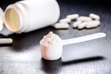 spoon of creatine, recommended supplement to increase strength, power and muscle mass.の写真素材