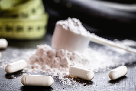 Sports supplement, creatine, hmb, bcaa, amino acid or powdered vitamin. Sports nutrition concept....
