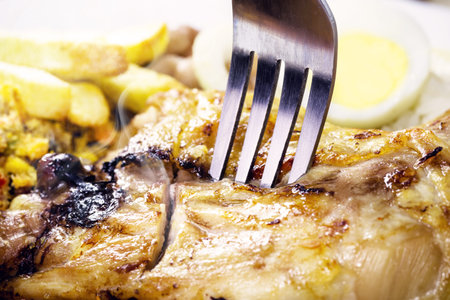 sliced â€‹â€‹chicken thigh with smoke coming out, hot meat smoking, chicken flavor