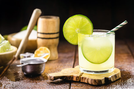 Lime alcoholic drink, made in Brazil, called caipirinha, with ice and vodka, a traditional drink...