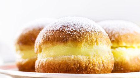 sweet bread or donut with sugar and stuffed with cream, called in Brazil as a bakery dream and in...