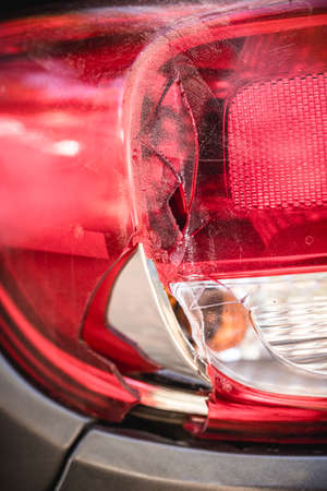 small rear collision on sports car, damaged taillight and headlight, broken glassの写真素材