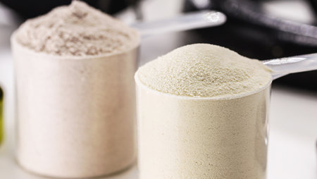 Measuring Spoon with Creatine or Whey, Food Supplement, Casein Cocktail, Muscle Mass Vitamin, Plated, Bodybuilding Conceptの写真素材