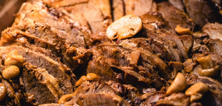 The typical Brazilian pork loin is a cut of pork, served at parties and barbecues in Brazil, savory and with vegetablesの写真素材