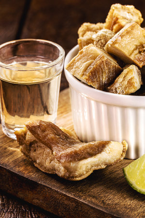 pork belly meat snack, crispy crackling typical of Minas Gerais, served with Brazilian cachaÃ§a, bar foodの写真素材