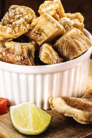pork belly meat snack, crispy crackling typical of Minas Gerais, served with Brazilian cachaÃ§a, bar foodの写真素材