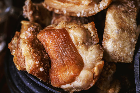 Brazilian crackling, an appetizer made by frying bacon, a layer of leather, meat and lots of fat, usually taken from the pork bellyの写真素材