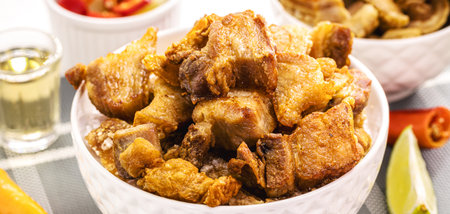 Crackling bowl, Brazilian appetizer made by frying bacon, leather or meat and lots of fat, taken from the pork belly.の写真素材