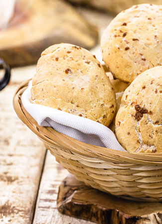 bowl full of traditional Brazilian cheese bread or cheese biscuit, served crispy and hot, with coffeeの写真素材