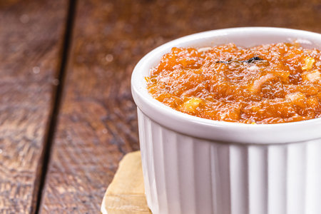 Brazilian pumpkin jam made by emc asa, in a rustic wooden setting, copyspaceの写真素材