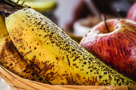 red ants indoors on rotten fruit, banana with insects, fruit with insects in the kitchen, pinpoint focusの写真素材