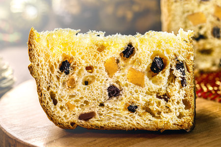 candied fruit panettone, slice of traditional baked Christmas cake for Christmas and New Year.の写真素材