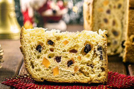 Sugar-free diet panettone, filled with sweet fruit, slice of traditional Christmas & New Year baked Christmas cake.の写真素材