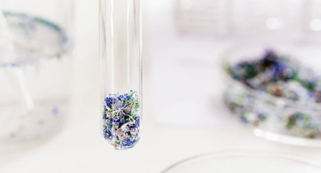 close-up of test tube with traces of plastic and micro plastic taken from the ocean, polymer...