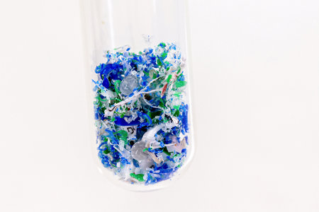 close-up of test tube with traces of plastic and micro plastic taken from the ocean, polymer particles, pollutant from the seas, environmental problemの写真素材