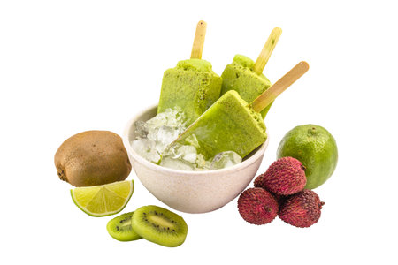 kiwi popsicle isolated on white background made with fresh fruits insideの写真素材