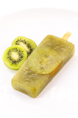kiwi popsicle isolated on white background made with fresh fruitsの写真素材
