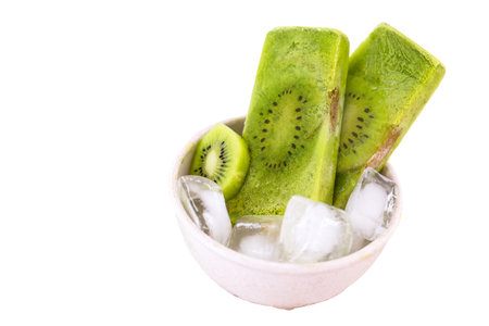 kiwi popsicle isolated on white background made with fresh fruits insideの写真素材