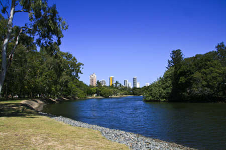 Beautiful blue river with skyscrapers in backgroundの写真素材