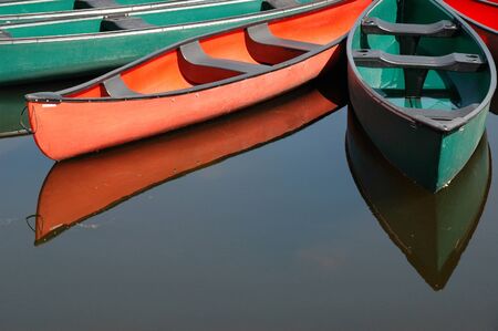 Rental canoes tied up at wharf at the pavilion on Dows Lake in central Ottawa, Ontario, Canadaの写真素材