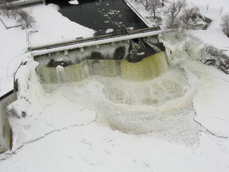 Rideau Falls in winter. The Rideau Falls are at the junction of the Rideau River and the Ottawa River. This picture was taken from a camera rig suspended below a kite (Kite Aerial Photography - KAP).のeditorial素材