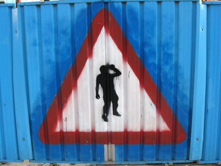 Yield to drunkards. Painted on construction perimeter fence in downtown Leeds, England.の写真素材
