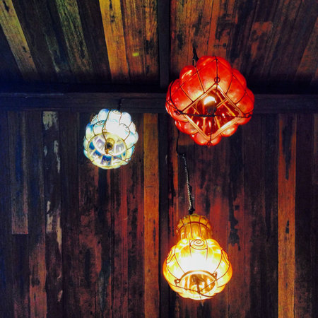 Bright colored lanterns adore this wooden ceiling in a restaurant in Tagaytay Philippinesの素材