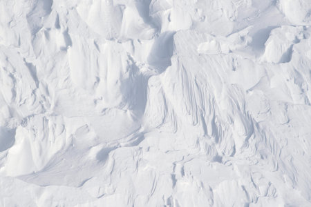 2 - deeper shadows are cast into the bowls and pits and fine lines that mountain winds have carved...
