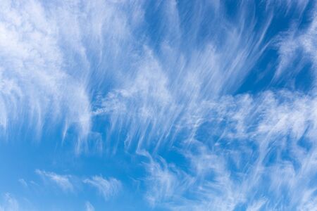 Bright blue sky with feather white cloud.の写真素材