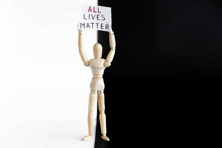 All Lives Matters protester. Wooden mannequin holding signs banner.の写真素材