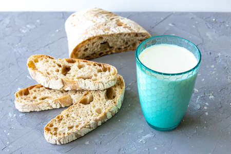 Bread and milk in blue glass. top viewの写真素材
