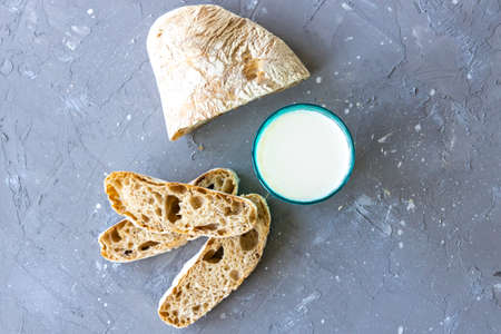 Bread and milk in blue glass. top viewの写真素材