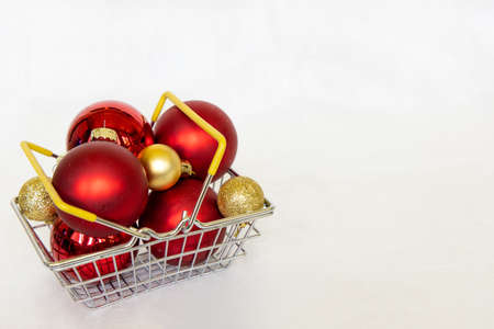 Shopping cart with red and gold xmas ball. New year bubble. marry Christmas conceptの写真素材