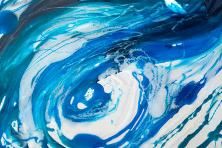 Epoxy resin art. Texture of blue and white paint. Fluid art, kintsugi. Close upの写真素材