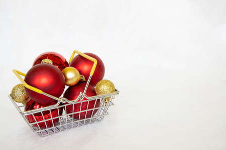 Shopping cart with red and gold xmas ball. New year bubble. marry Christmas conceptの写真素材