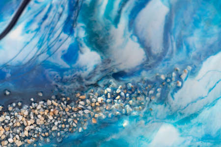 Epoxy resin art. Texture of blue and white paint. Fluid art, kintsugi. Close upの写真素材