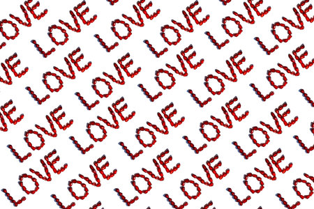 Love word from red pomegranate seeds. Valentine's day concept. Sign pattern. Isolated on white backgroundの写真素材