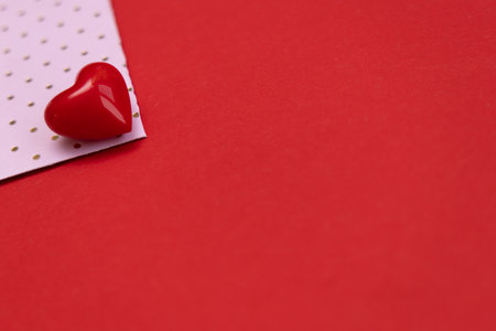 Valentines day red heart on same color background. Monochromatic vivid color. Valentine's day concept. Close up, copy spaceの写真素材