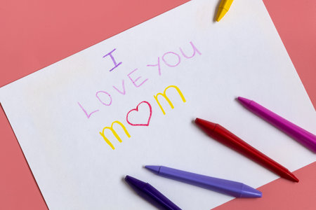 Greeting card for mummy on happy mothers day. Handwritting by kids with love congratulate for mom. Sign I love you momの写真素材