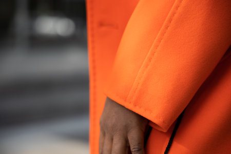 Close up of luxurious orange cashmere fabric on coat.の写真素材