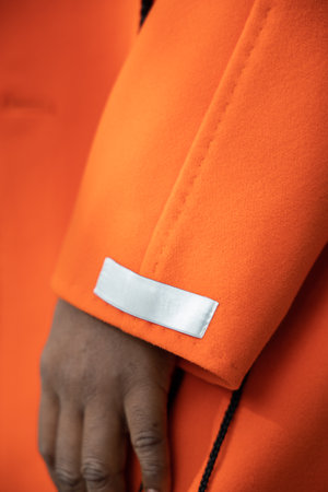 Close up of luxurious orange cashmere fabric on coat.の写真素材
