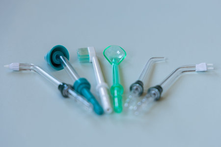 Various attachments for portable dental irrigator