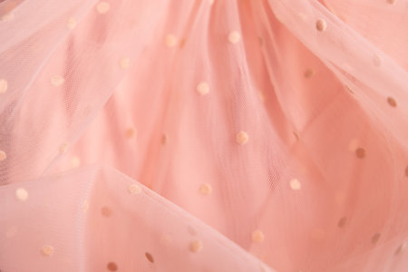 Tulle fabric texture background, textile pattern, pink polka dot on tulle, copy spaceの写真素材